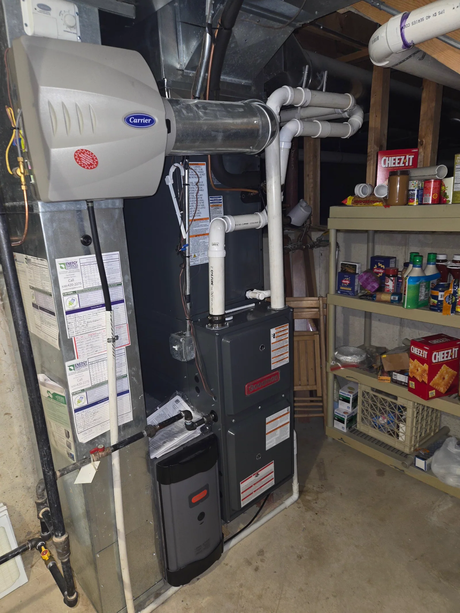 High-efficiency furnace with visible PVC condensate and vent piping