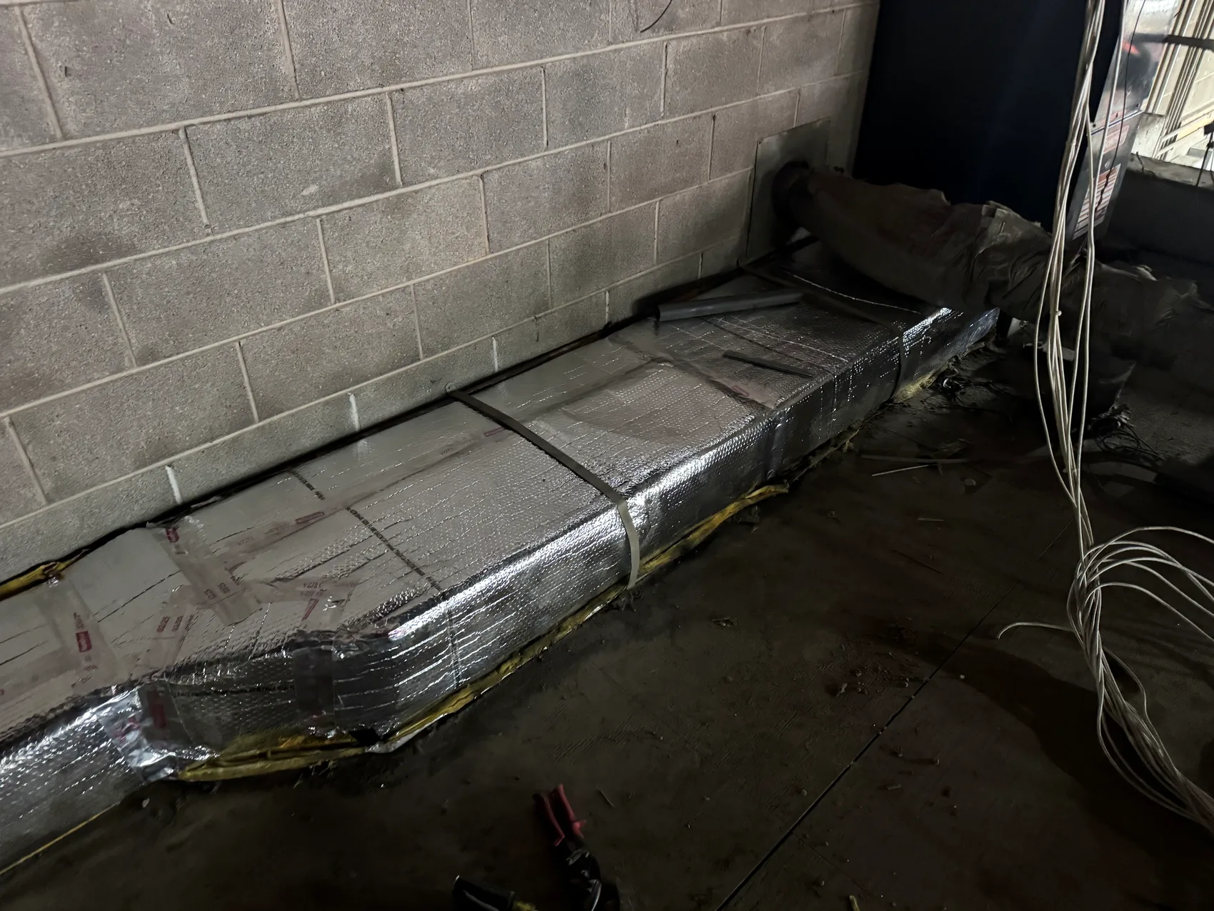 Insulated residential ductwork inspected during HVAC service