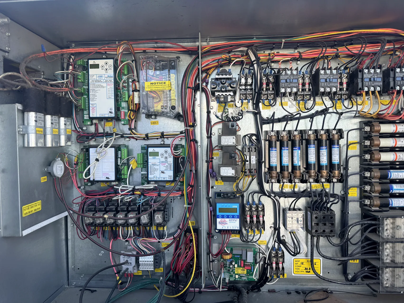 Open HVAC control panel inspected during diagnostic service